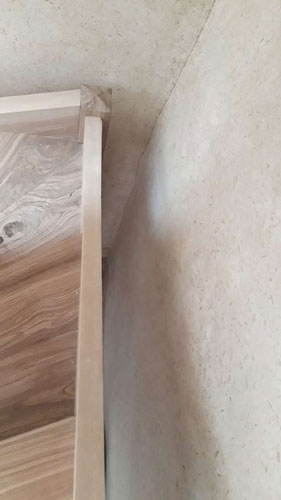 another irregular wall set away from the stringboard