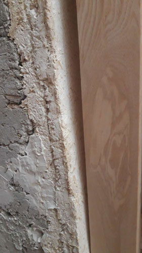 wall at an angle to newel post