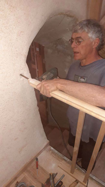 metal bolt attaching handrail to wall