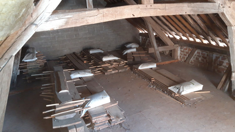 wood stacked in attic